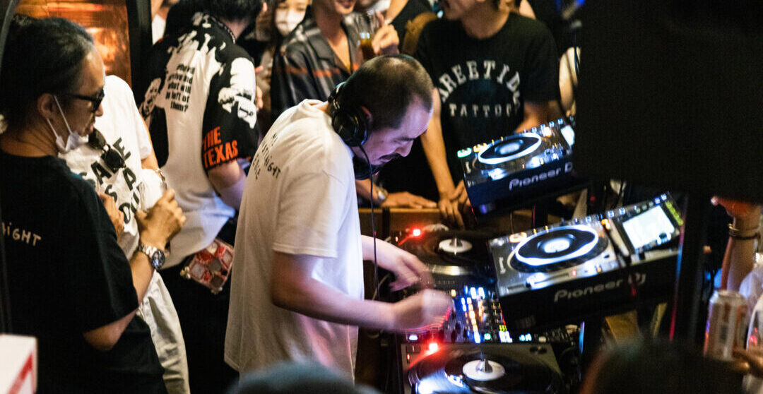 a dj spinning records at ace hotel kyoto