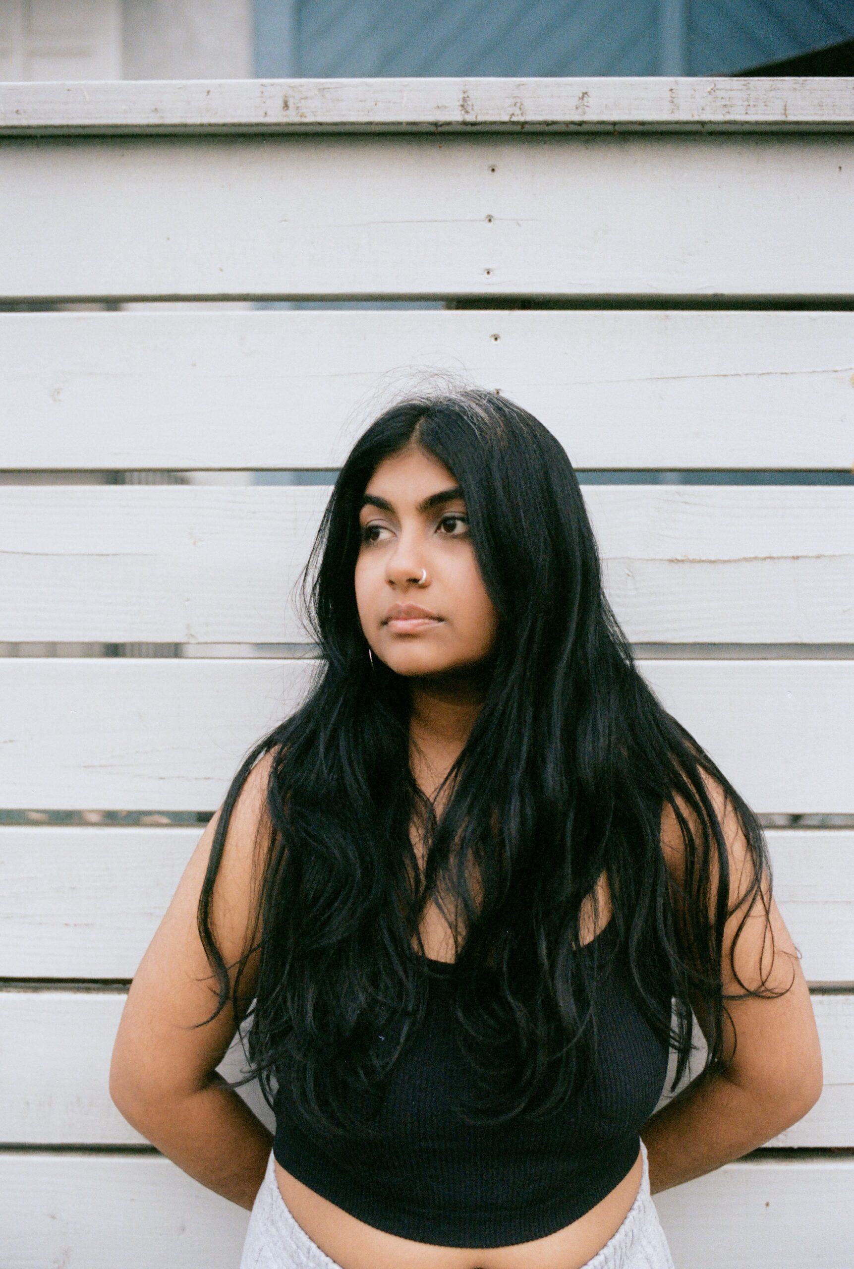 Sharada Shashidhar in front of a wall