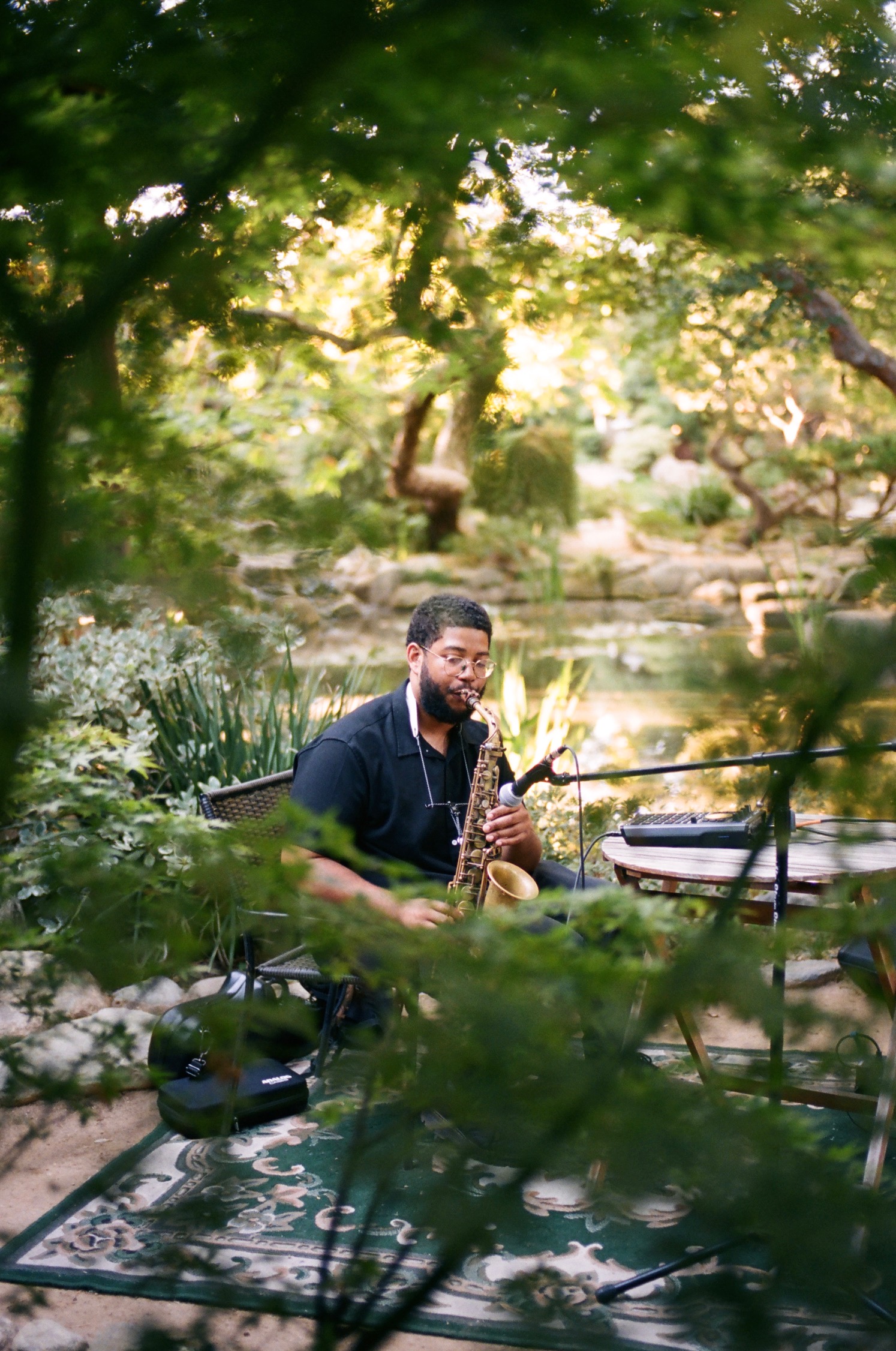 Devin Daniels playing sax in the park